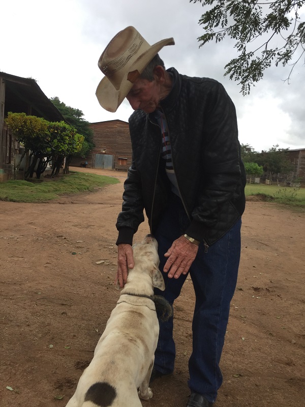 Chandito Gomez working at TABSA with a Guardian of the Farm